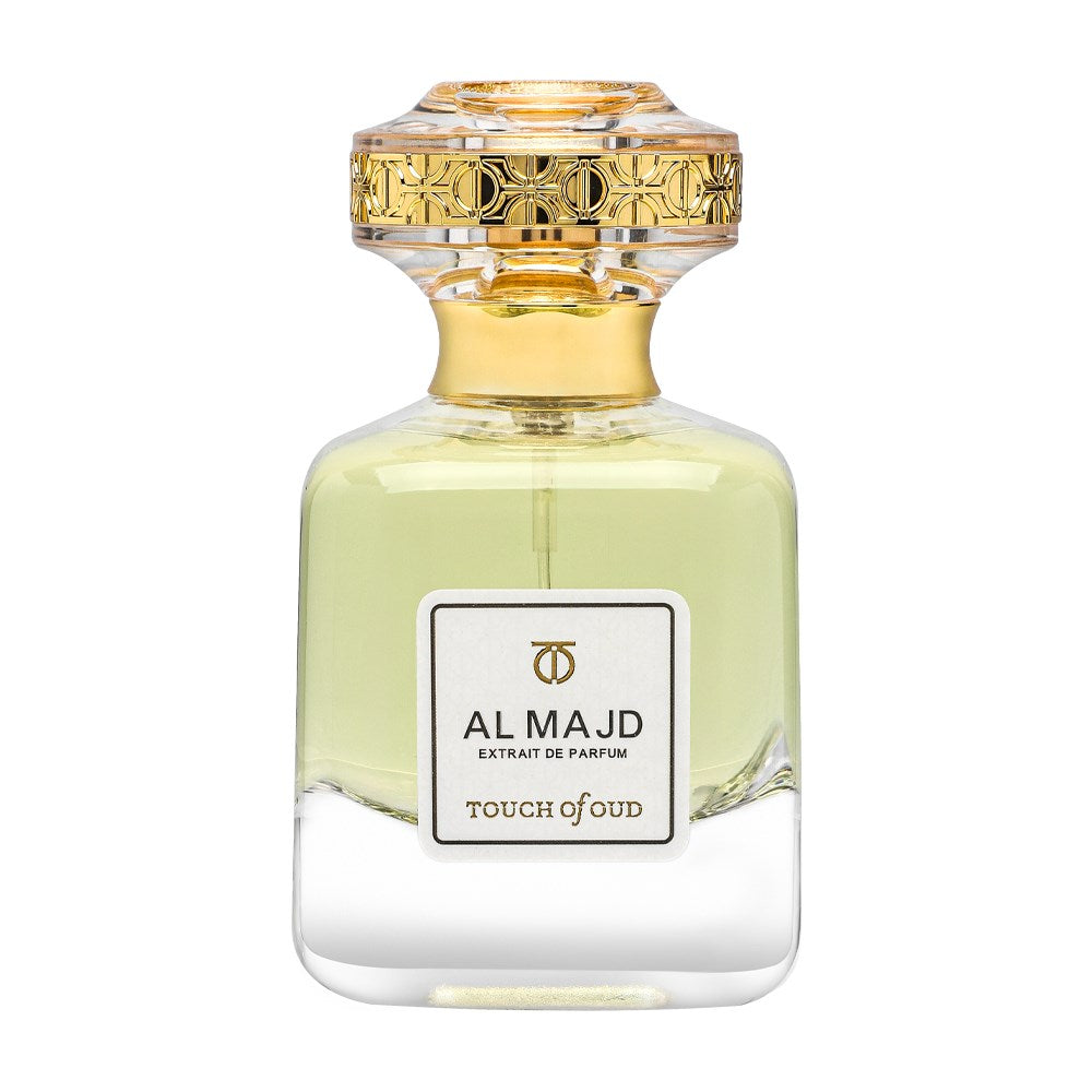 Touch of Oud Al Majd extrait perfume bottle with golden cap and clear glass design