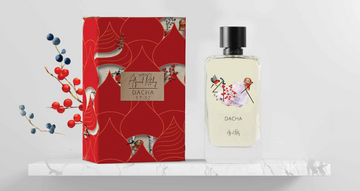 ALFRED RITCHY DACHA niche perfume bottle and red decorative box displayed on white marble surface