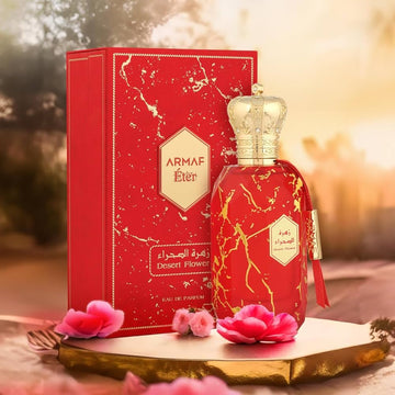 ARMAF Desert Flower perfume bottle and red marble patterned packaging with gold crown cap