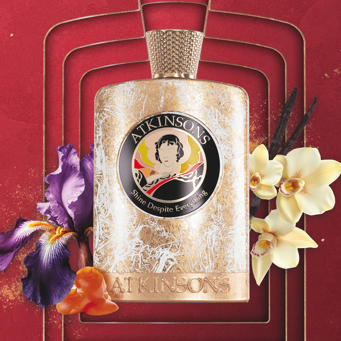 ATKINSONS Shine Despite Everything perfume bottle with floral accents on red background