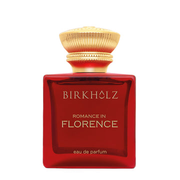 Birkholz Romance in Florence perfume in a red glass bottle with a gold decorative cap