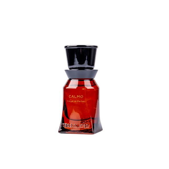 Teab Alater Calmo niche perfume in a sleek amber glass bottle with black cap