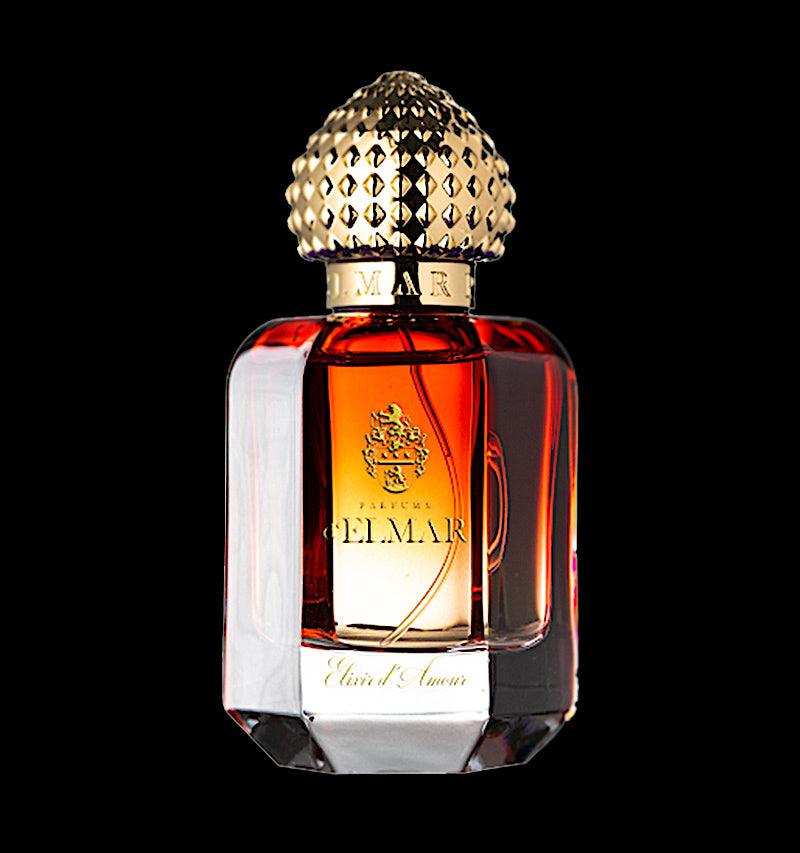 DELMAR Elixir D’Amour niche perfume in a luxurious faceted glass bottle with gold textured cap