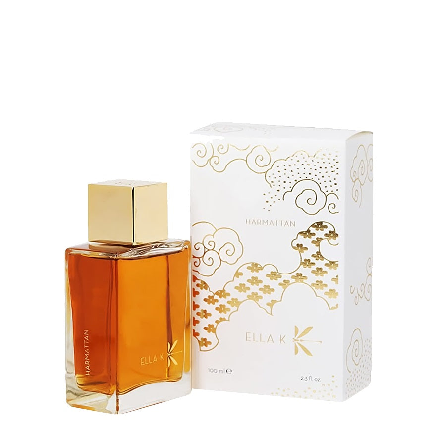 ELLA K Harmattan eau de parfum 100ml bottle with golden liquid placed on rocky surface inside a cave