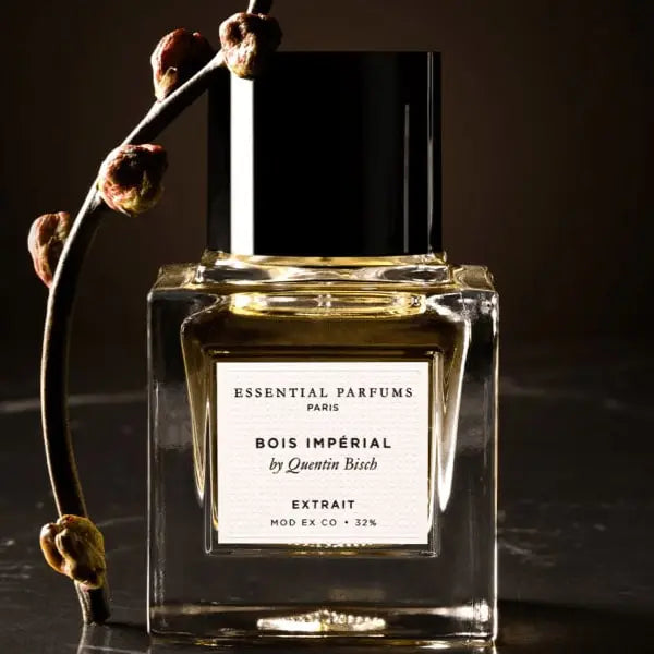 Essential Parfums Paris Bois Imperial Extrait De Parfum 30ml bottle with black cap and dried branch