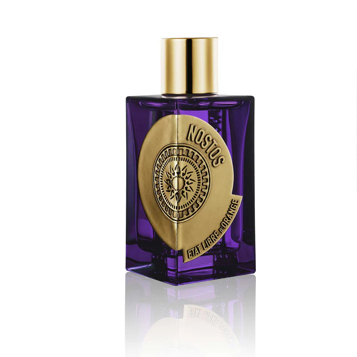 Etat Libre d'Orange Nostos perfume in a unique purple bottle with a gold emblem