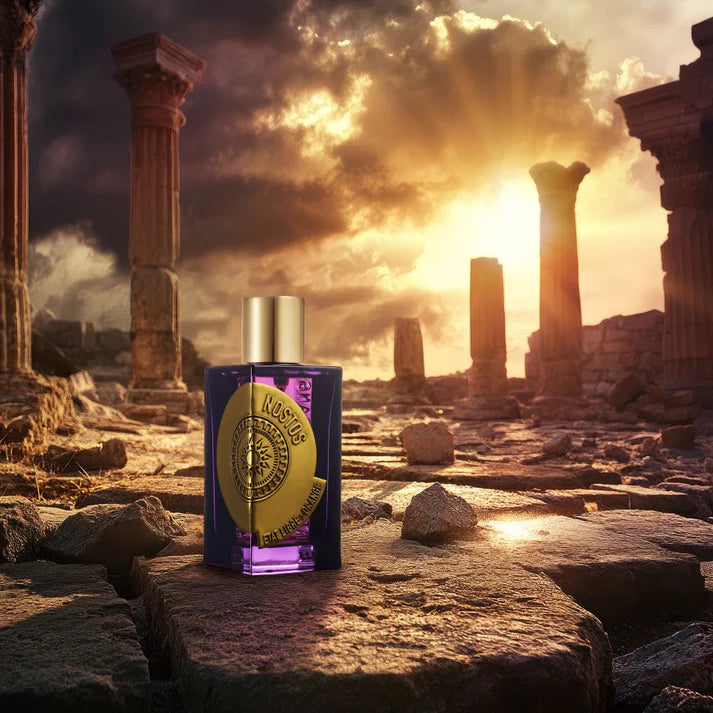 Etat Libre d'Orange Nostos perfume in an ancient ruins setting with a stunning sunset backdrop