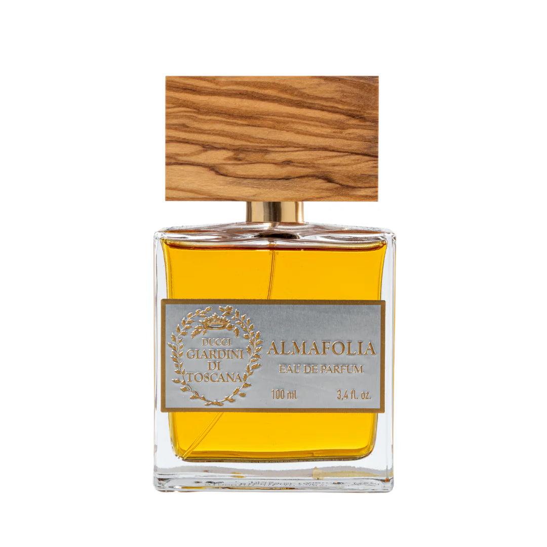 Giardini Di Toscana Almafolia perfume bottle with wooden cap and golden yellow fragrance inside