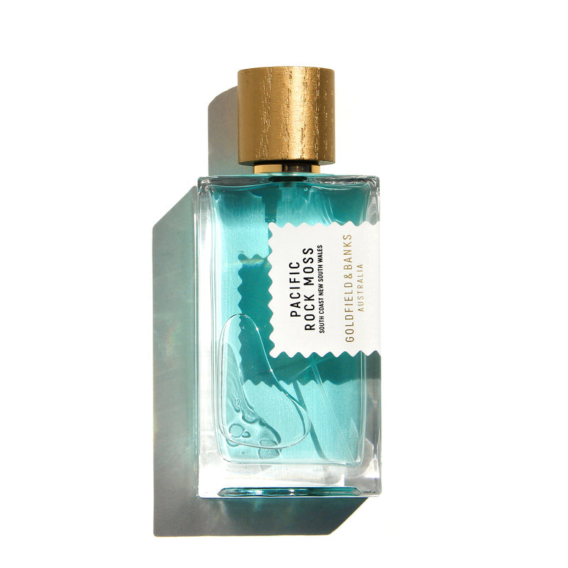 Goldfield & Banks Pacific Rock Moss perfume bottle with aqua blue liquid and textured gold cap