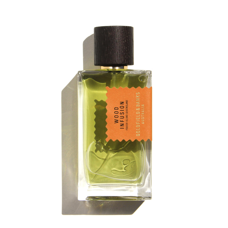 Goldfield and Banks wood infusion perfume in clear glass bottle with dark wooden cap and orange label