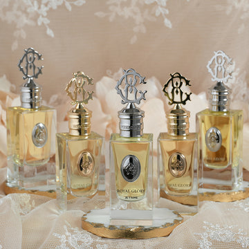 ROYAL GLORY JE T'AIME 60ml niche perfume bottles with elegant metal caps displayed on lace fabric