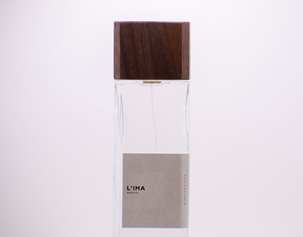 Perfumology L'ima perfume 60ml bottle with wooden cap and minimalist label design