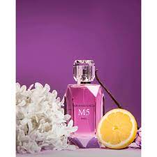 MICHAEL CINCO M5 niche perfume bottle with white flowers and lemon slice on purple background