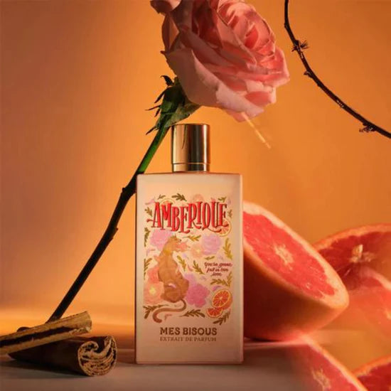 Amberique extrait de parfum by MES BISOUS with decorative floral and citrus packaging and bottle