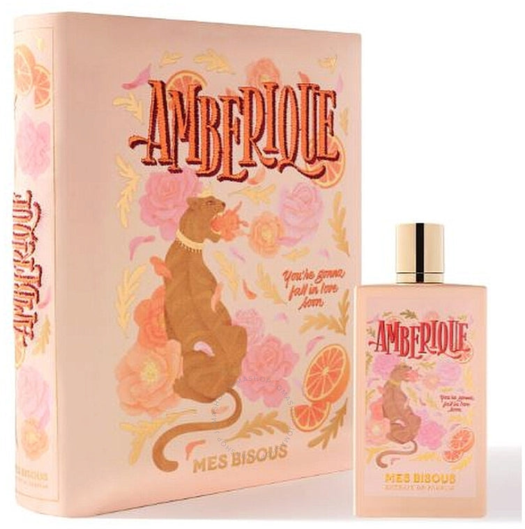 Amberique extrait de parfum by MES BISOUS with decorative floral and citrus packaging and bottle