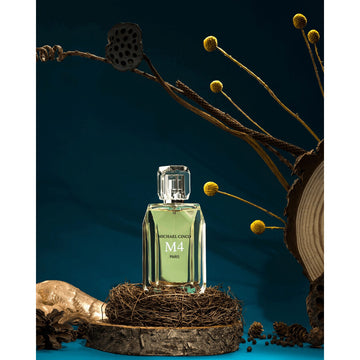 Michael Cinco M4 Paris perfume bottle with green liquid displayed on rustic wooden base and natural dried floral decor