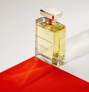 Ormonde Jayne Ambre Royal perfume 120ml in clear glass bottle with gold cap on white and red background