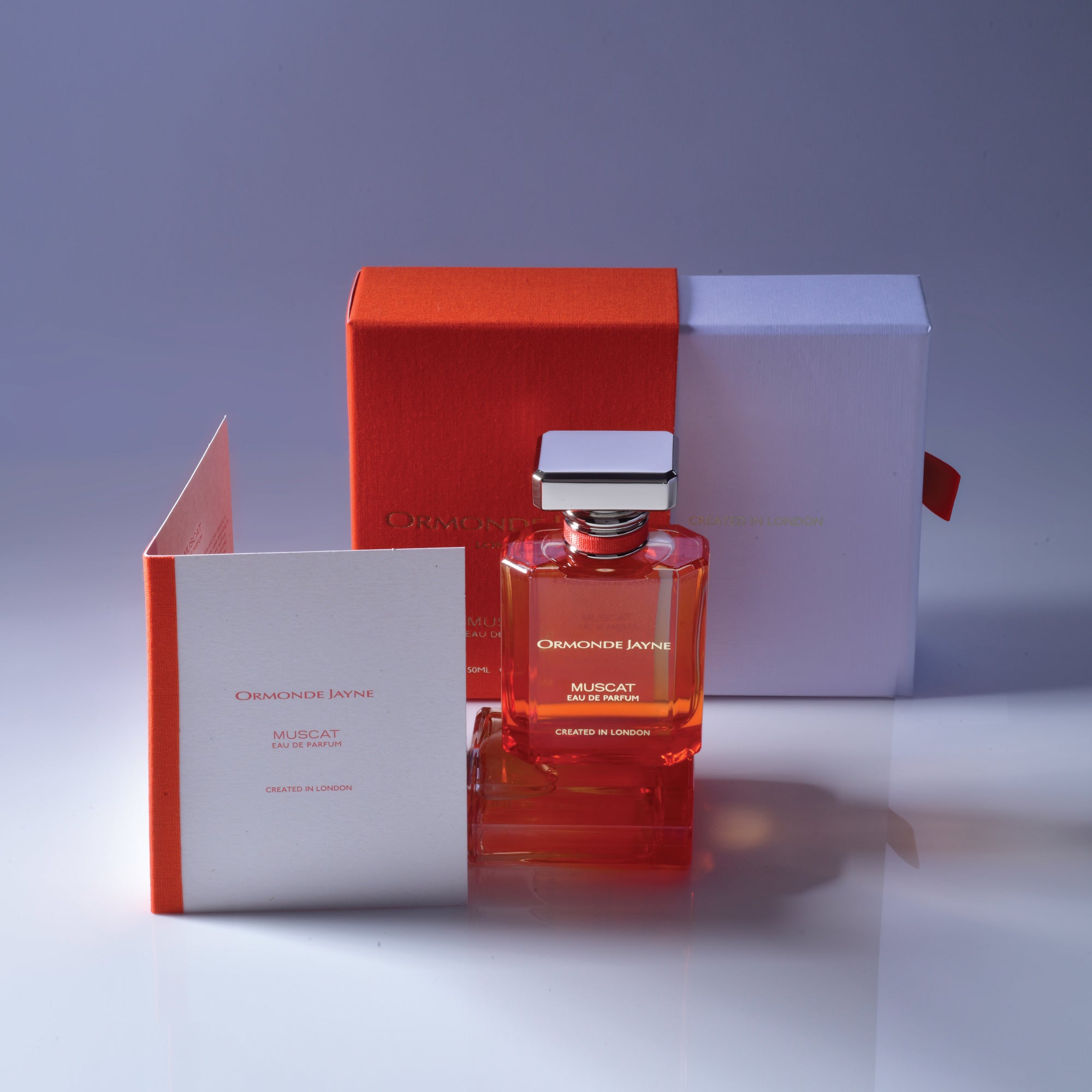 Ormonde Jayne Muscat niche perfume bottle with orange and white packaging and product leaflet