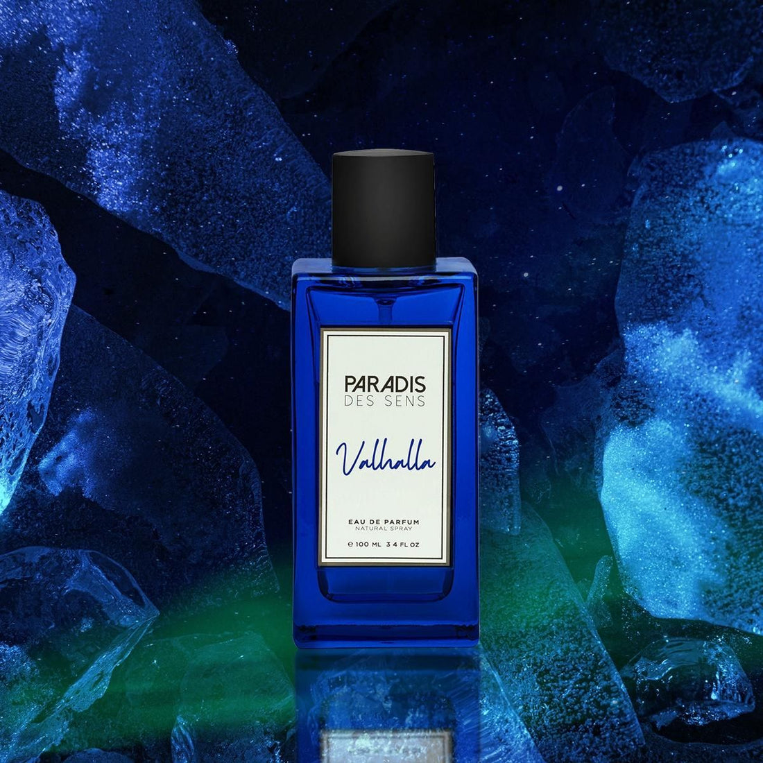 Paradis Des Sens Valhalla fragrance blue glass perfume bottle with black cap on icy blue background