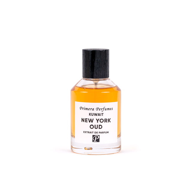 Primera Perfumes New York Oud perfume bottle with amber liquid and black cap