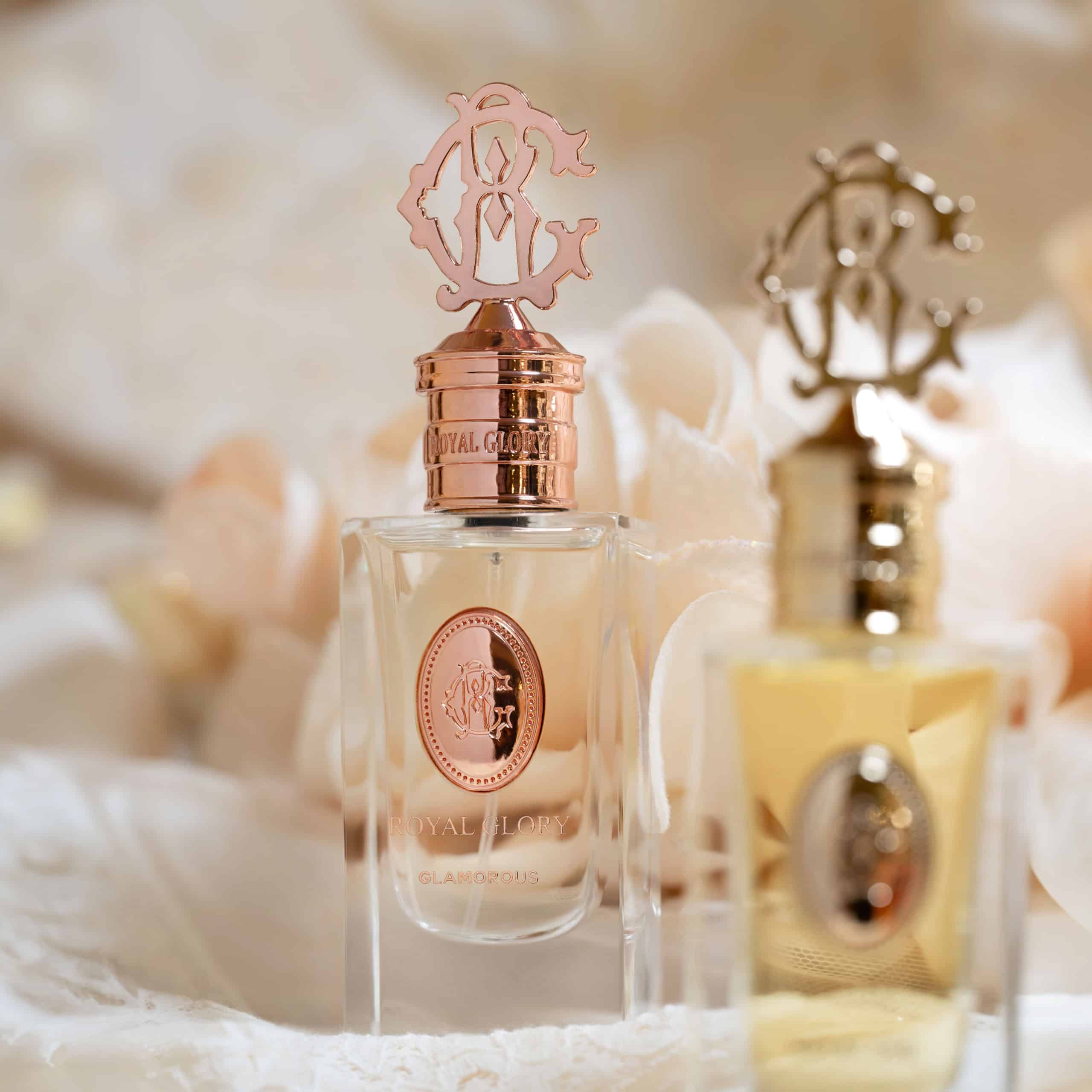 ROYAL GLORY GLAMOROUS 60ml perfume bottle with elegant rose gold cap on soft background