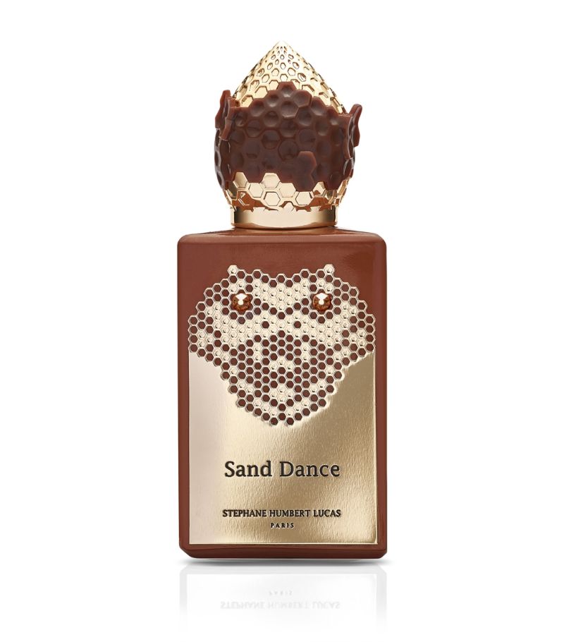 Sand Dance perfume by STÉPHANE HUMBERT LUCAS in a luxurious brown bottle with intricate design