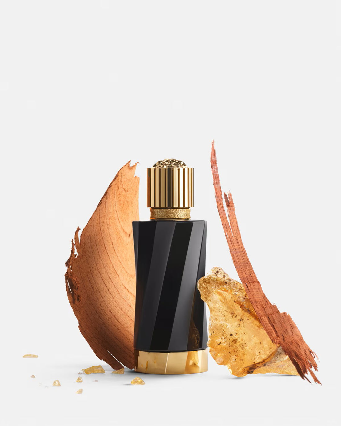 Versace Atelier Ambre Nectar perfume black and gold bottle with amber and wood scent elements