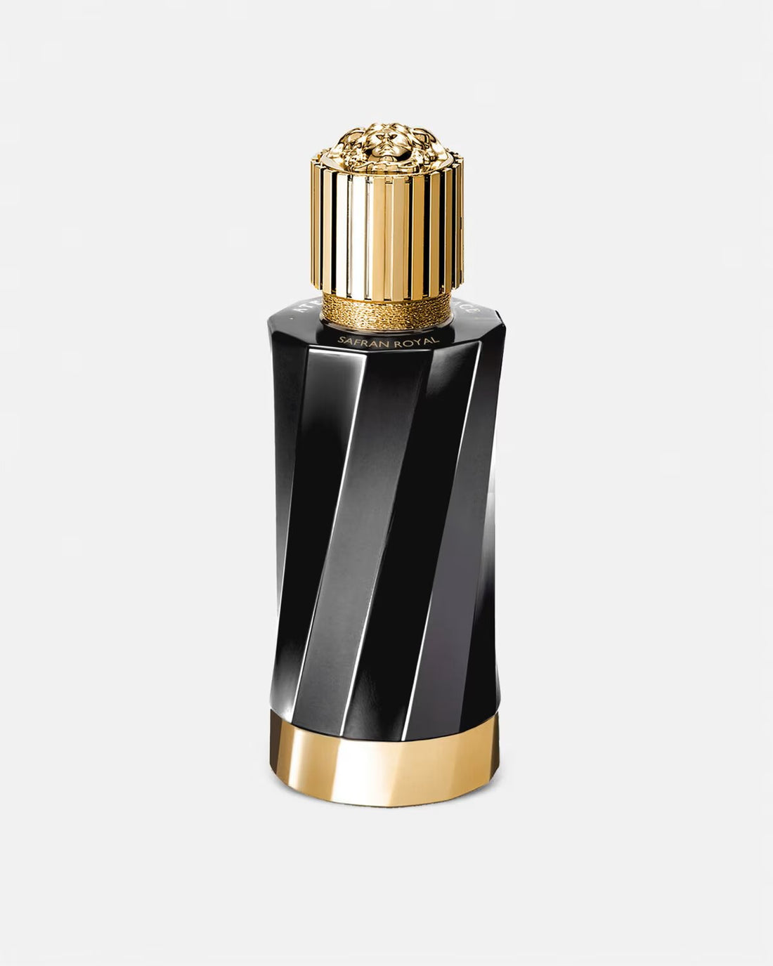 Versace Atelier Safran Royal perfume with black bottle gold cap alongside saffron and green leaves