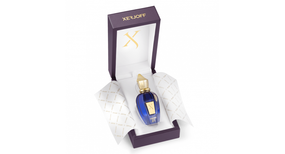 Xerjoff Torino 21 perfume bottle in deep blue with gold cap and label on black background