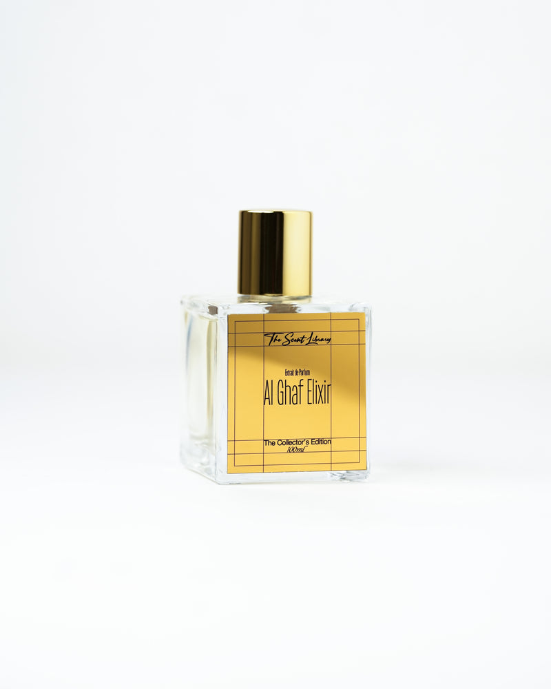 Al Ghaf Elixir perfume by The Scent Library, a clear square glass bottle with a gold cap and gold grid label, The Collector's Edition