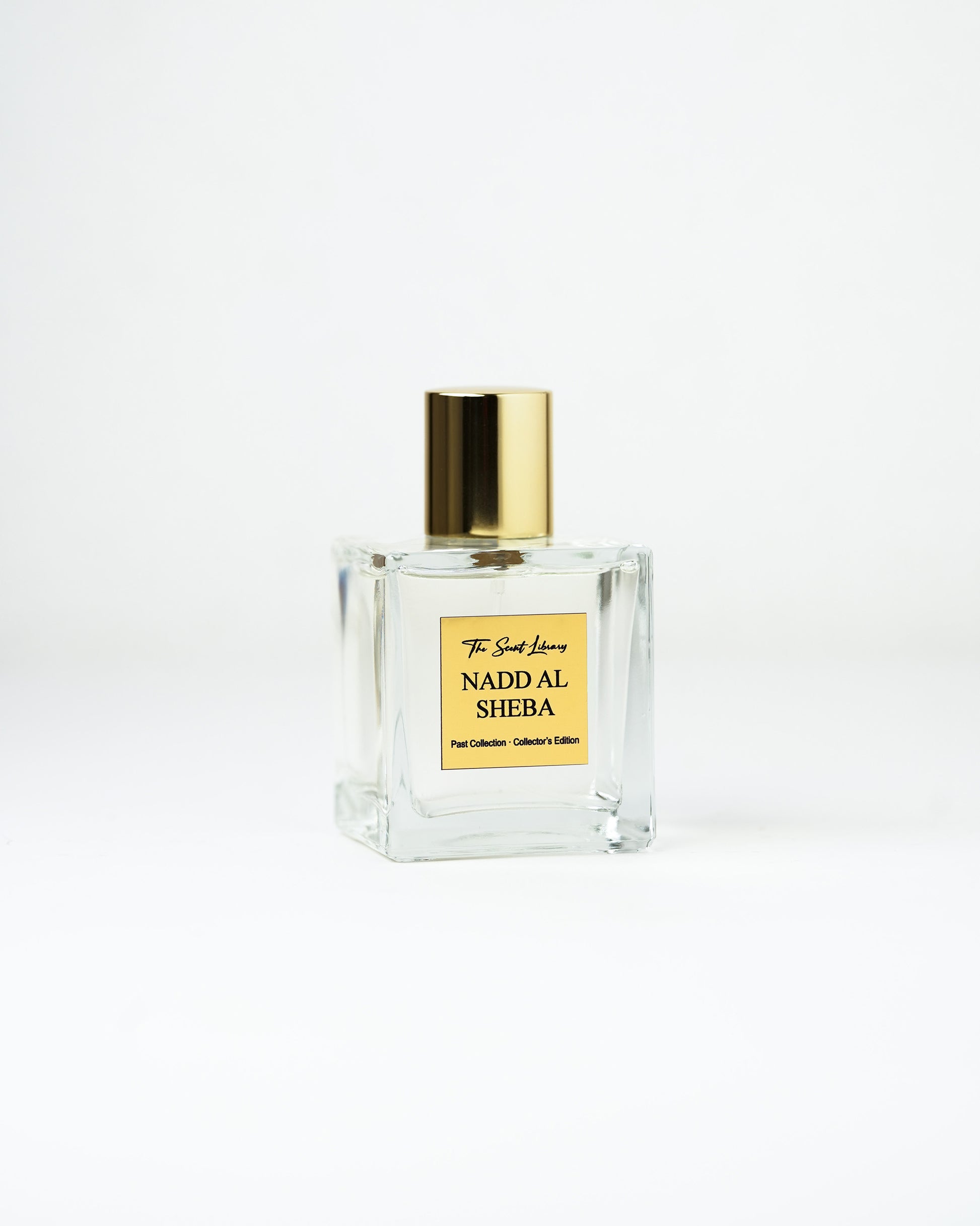 Nadd Al Sheba perfume by The Scent Library, a clear square glass bottle with a gold cap, an equestrian-inspired Collector's Edition