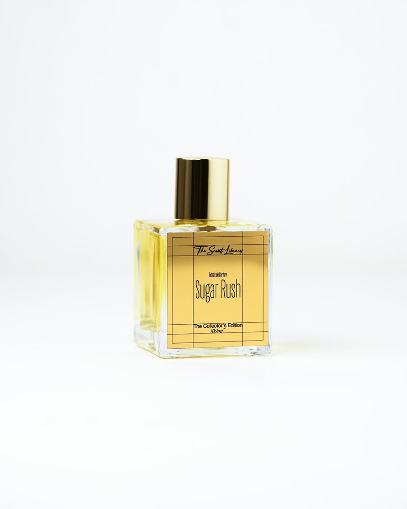 Sugar Rush extrait de parfum by The Scent Library, a clear square glass bottle with a gold cap and gold grid label, bestseller Collector's Edition