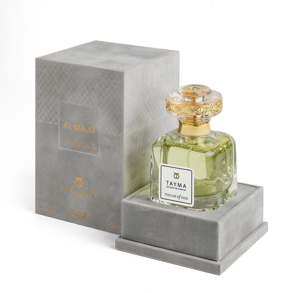 Touch Of Oud Tayma Extrait perfume bottle with elegant gold cap and luxury gray velvet box packaging