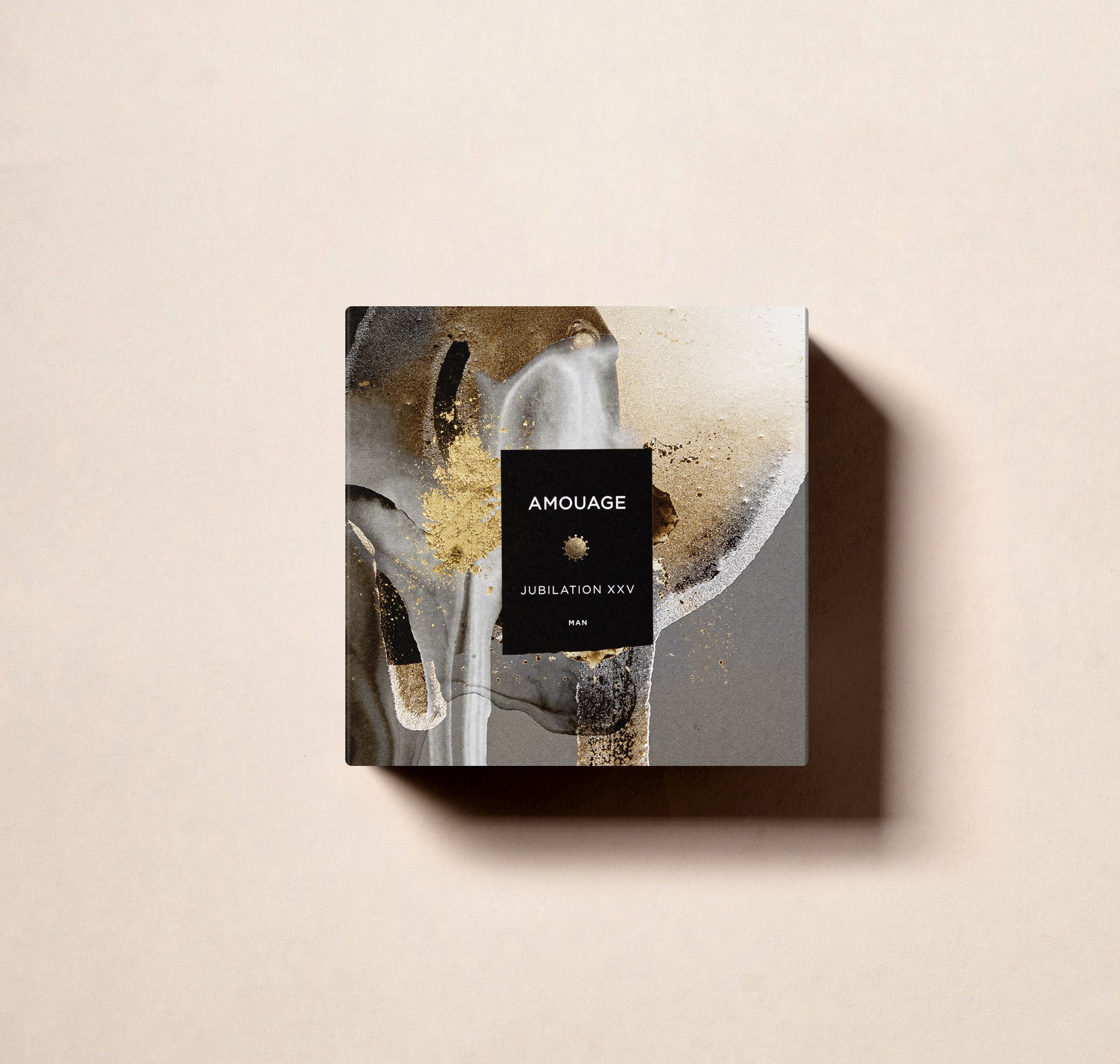 Amouage Jubilation XXV Man perfume box with abstract gold and gray design on beige background