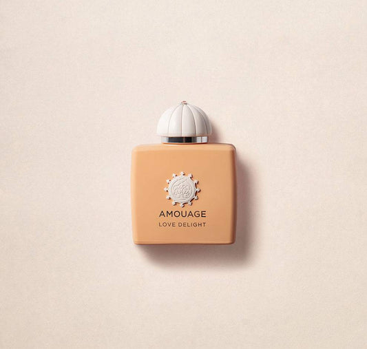 Amouage Love Delight perfume 100ml in a peach rectangular bottle with white decorative cap