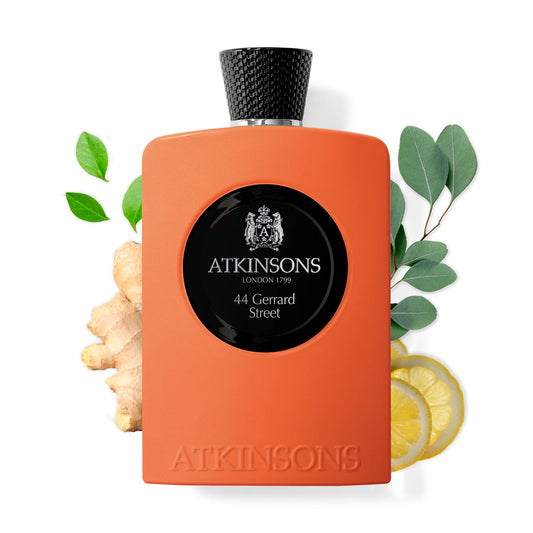Atkinsons 44 Gerrard Street cologne bottle with citrus, ginger, and green leaves backdrop