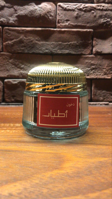 Atyaab du khon Bakhoor in a decorative glass jar with a gold lid for fragrant home ambiance