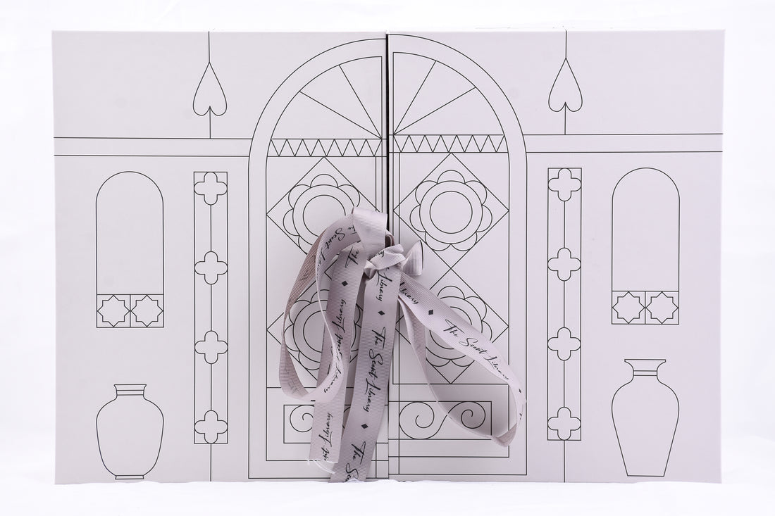 Baytak Collector’s Edition perfume set featuring four elegant black bottles in a decorative gift box