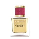 Birkholz Charm Mystery eau de parfum bottle with gold label and red cap luxury fragrance