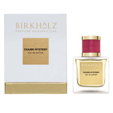 Birkholz Charm Mystery eau de parfum in a clear glass bottle with gold and red cap and matching packaging