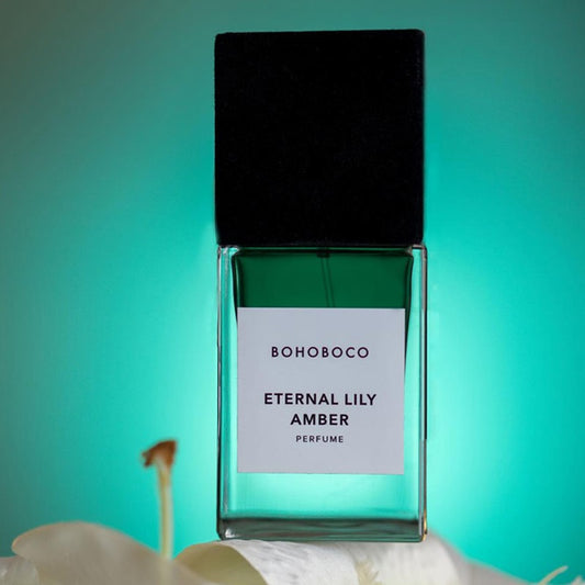 BOHOBOCO ETERNAL LILY AMBER perfume bottle with black cap on greenish background