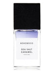 BOHOBOCO sea salt caramel perfume in a clear glass bottle with a black cap
