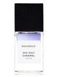 BOHOBOCO sea salt caramel perfume in a clear glass bottle with a black cap