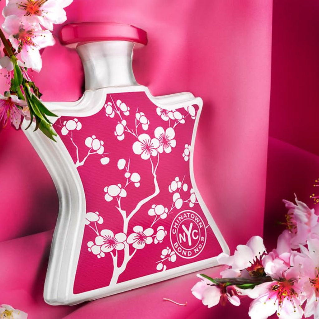 Bond No 9 Chinatown 100ml perfume bottle with pink floral design surrounded by cherry blossoms