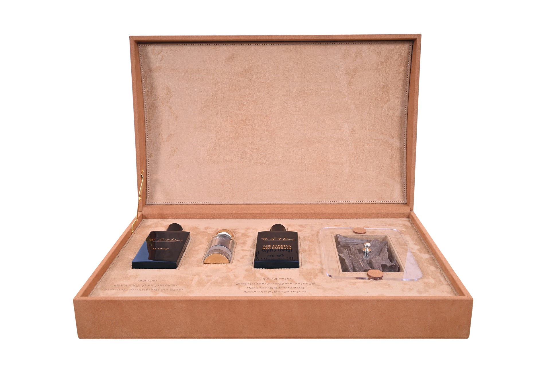 Scent Library camel leather perfume collection displayed in a luxurious open tan suede box