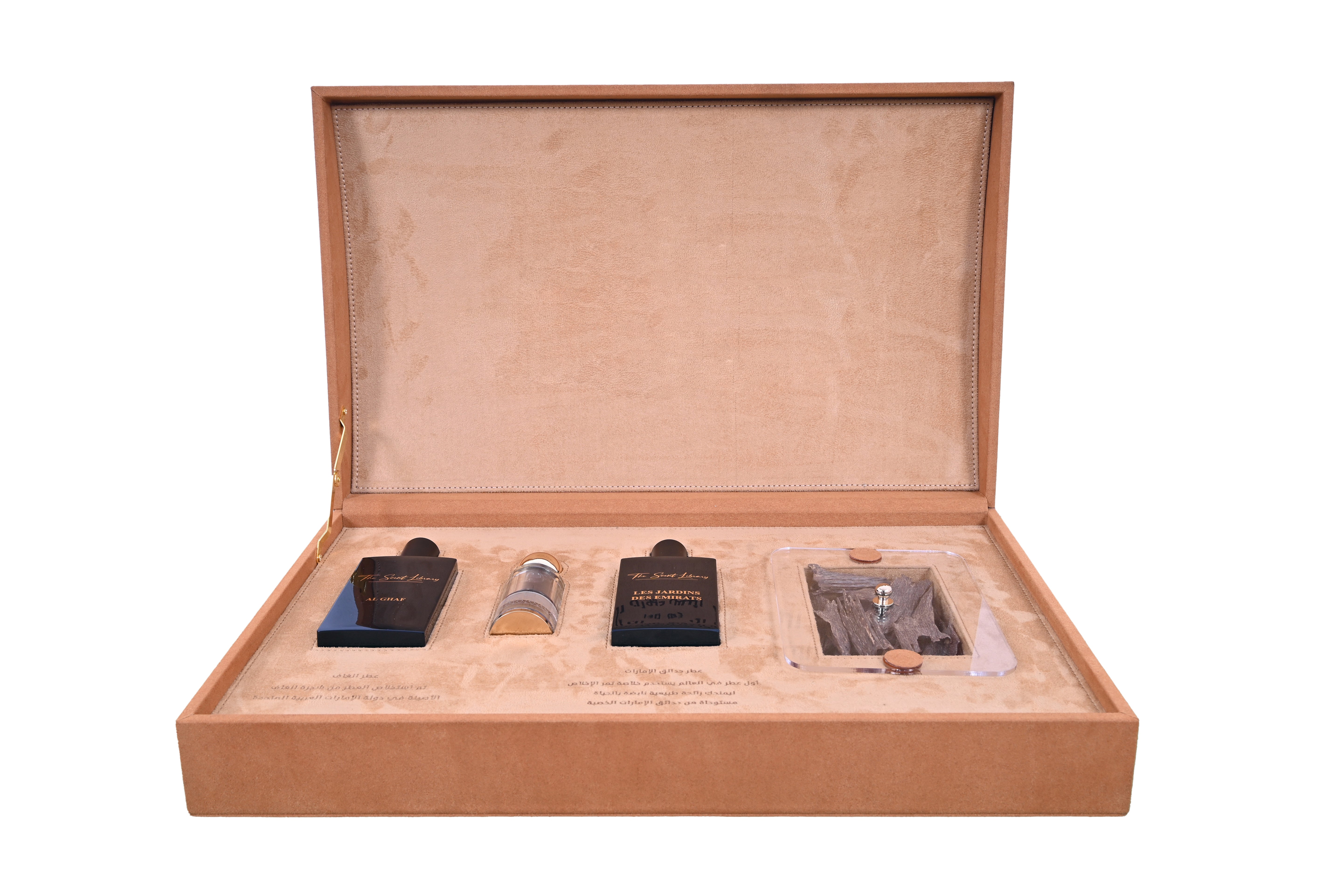Scent Library camel leather perfume collection displayed in a luxurious open tan suede box