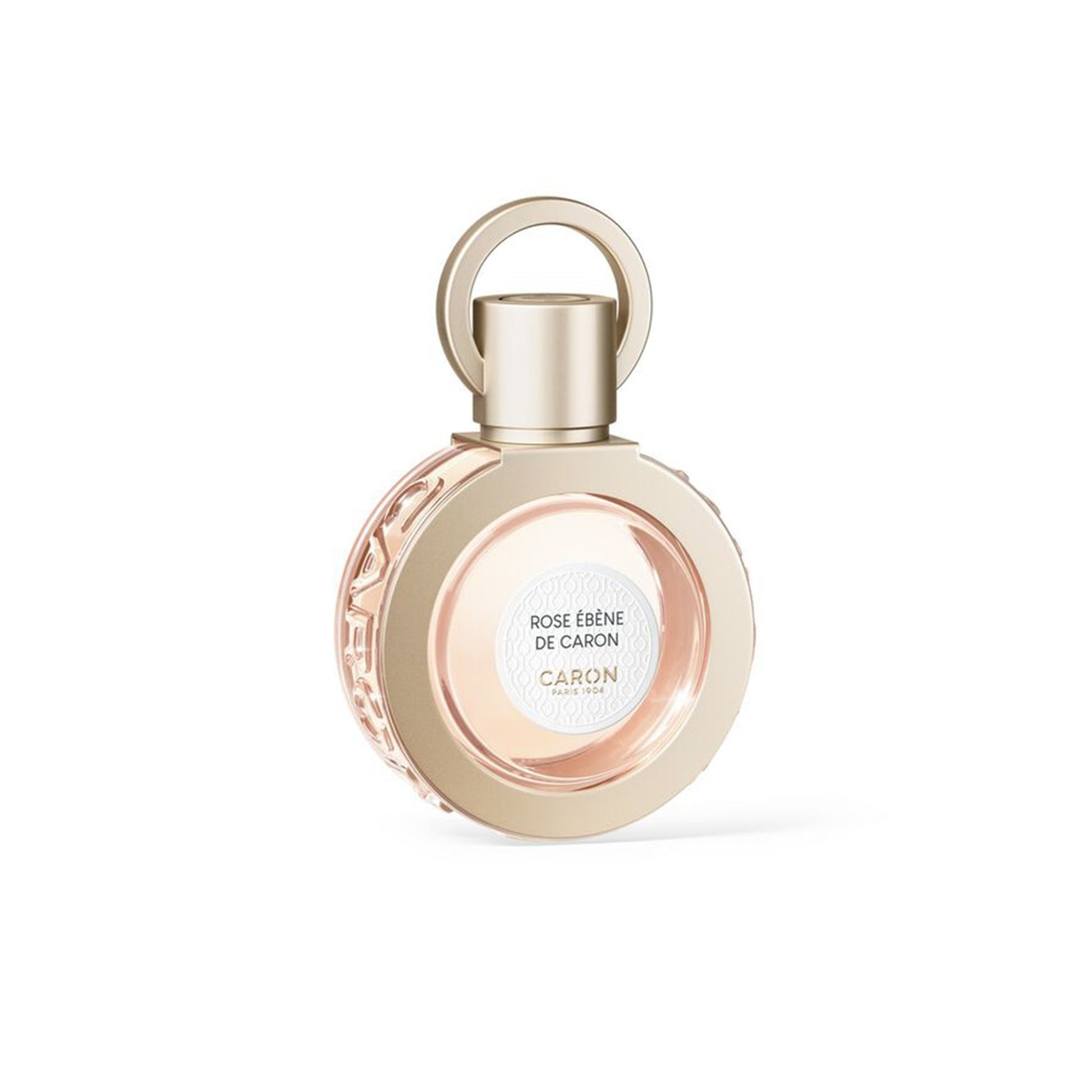 Caron Rose Ébène De Caron perfume bottle with elegant round gold design and soft pink fragrance inside