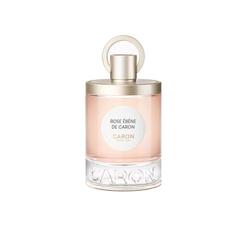 Rose Ébène De Caron perfume bottle with light pink fragrance and gold cap by Caron