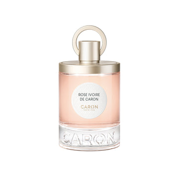 Caron Rose Ivoire Eau de Parfum bottle with light pink fragrance and gold cap