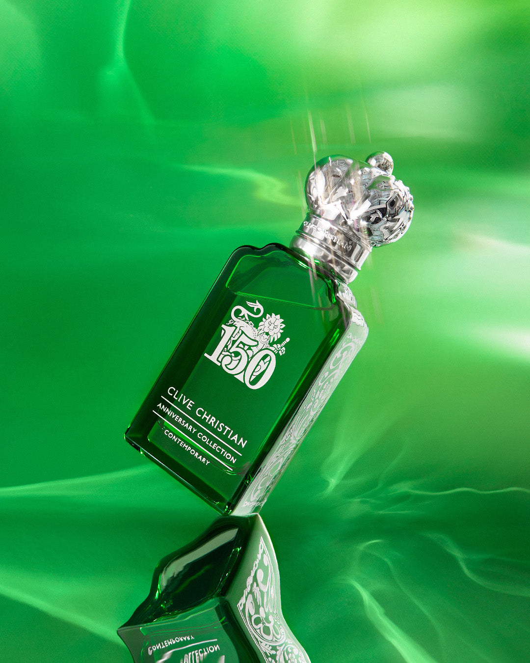 Clive Christian green bottle perfume from Anniversary Collection with crown cap contemporary niche fragrances Dubai